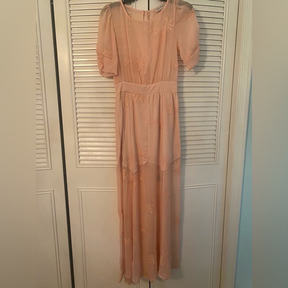Long pink lace dress. Lined at the bottom.